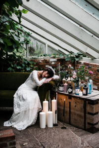Bride lying on a table at the secret garden in Kent